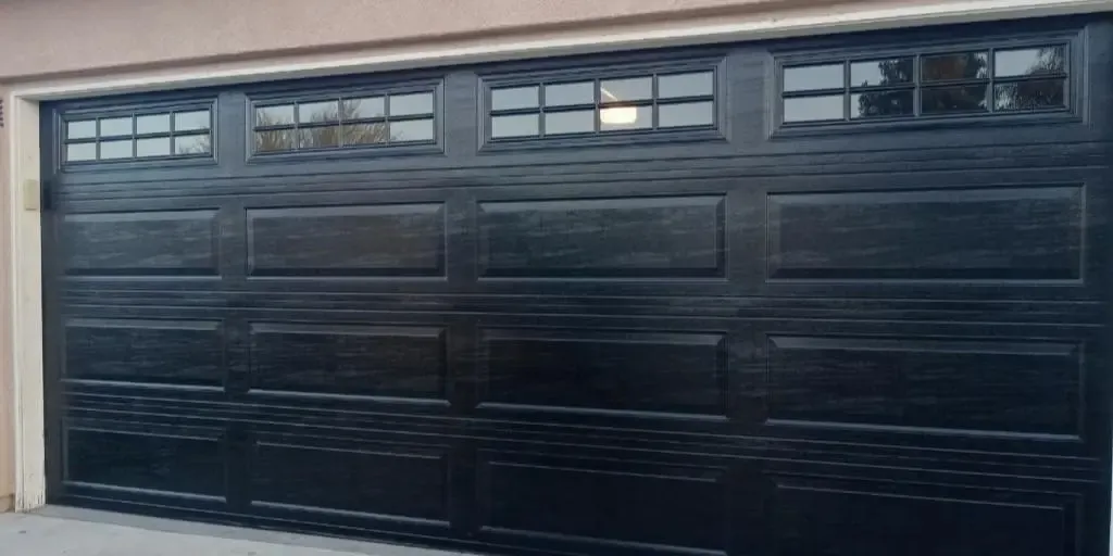 Black sectional garage door with upper windows