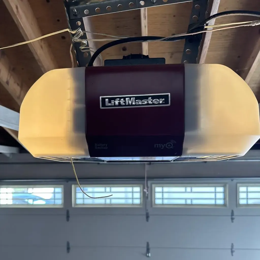 Garage door operator mounted overhead